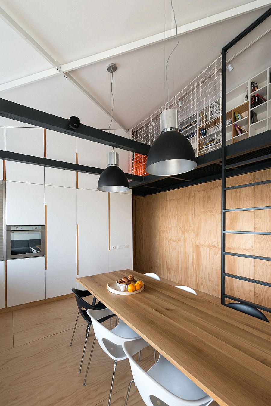 Sleek white kitchen cabinets blend into the backdrop