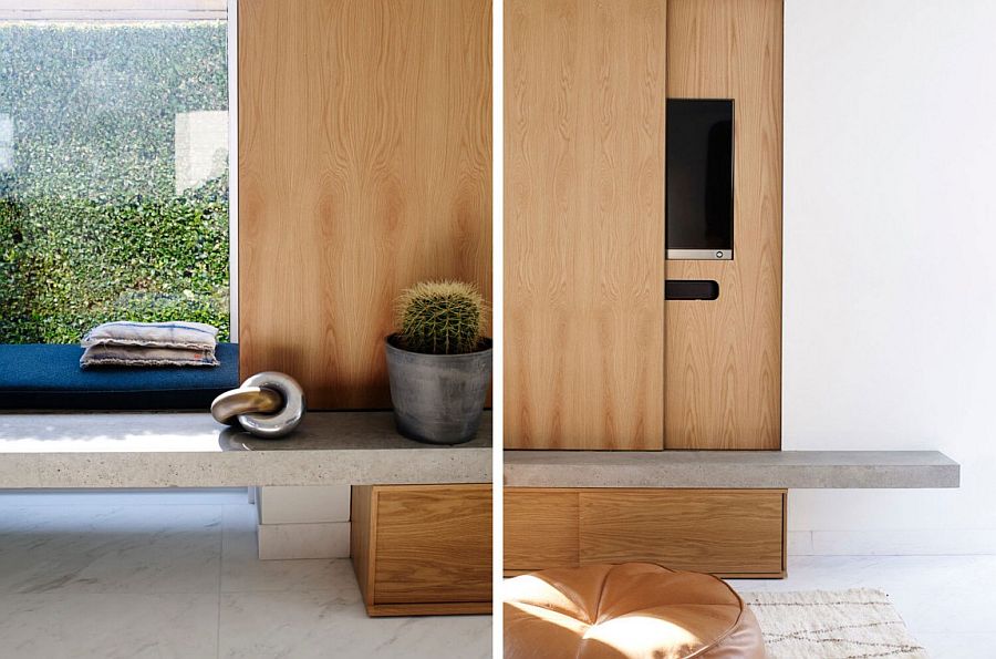 Sliding wooden panel in the living room hides the Television