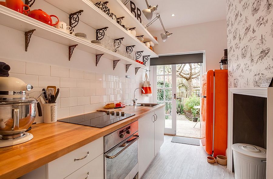 Small city apartment kitchen with pops of orange [Design: Etre]