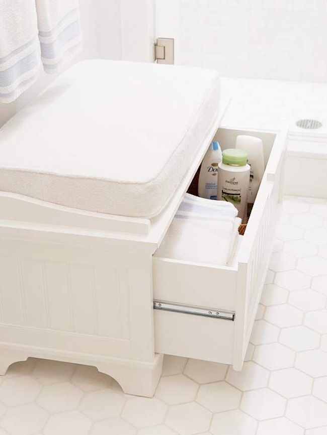 Small white bench with upholstered cushion and storage drawer