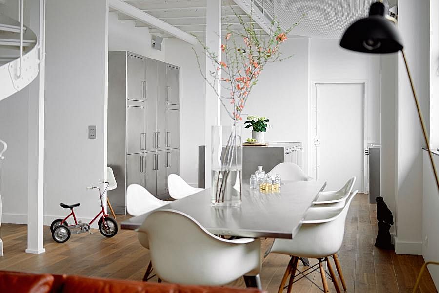 Stainless steel dining table complements the style of the kitchen
