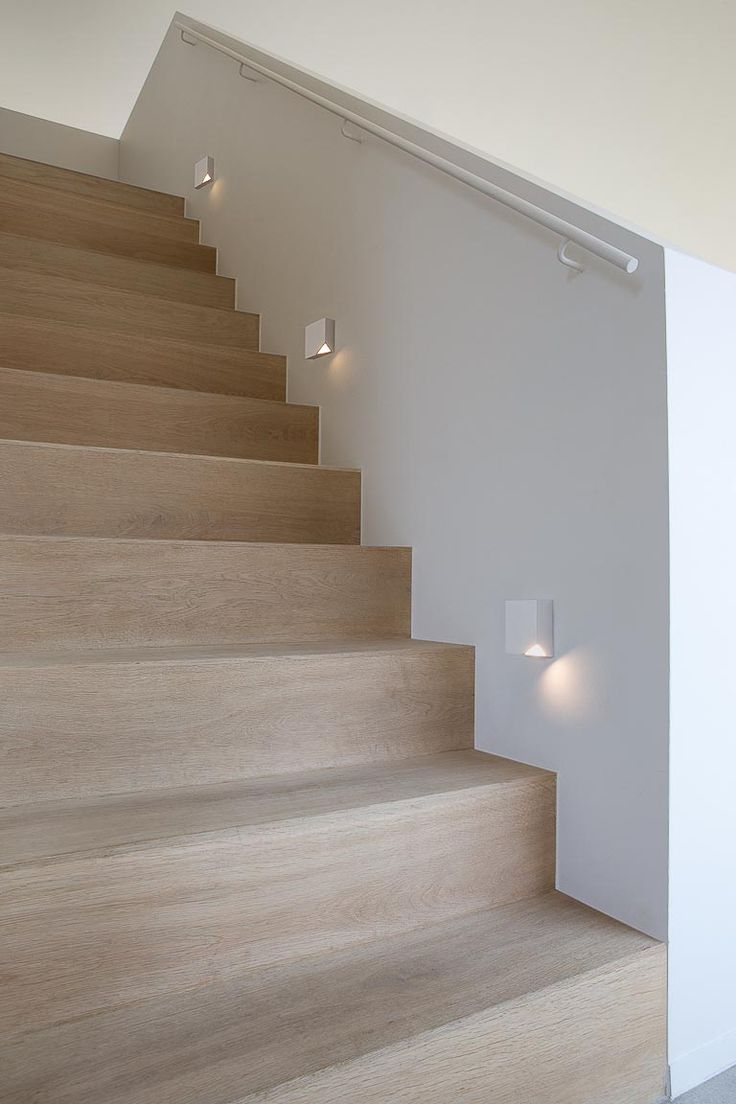 Staircase light fixtures with corners removed to light up the steps