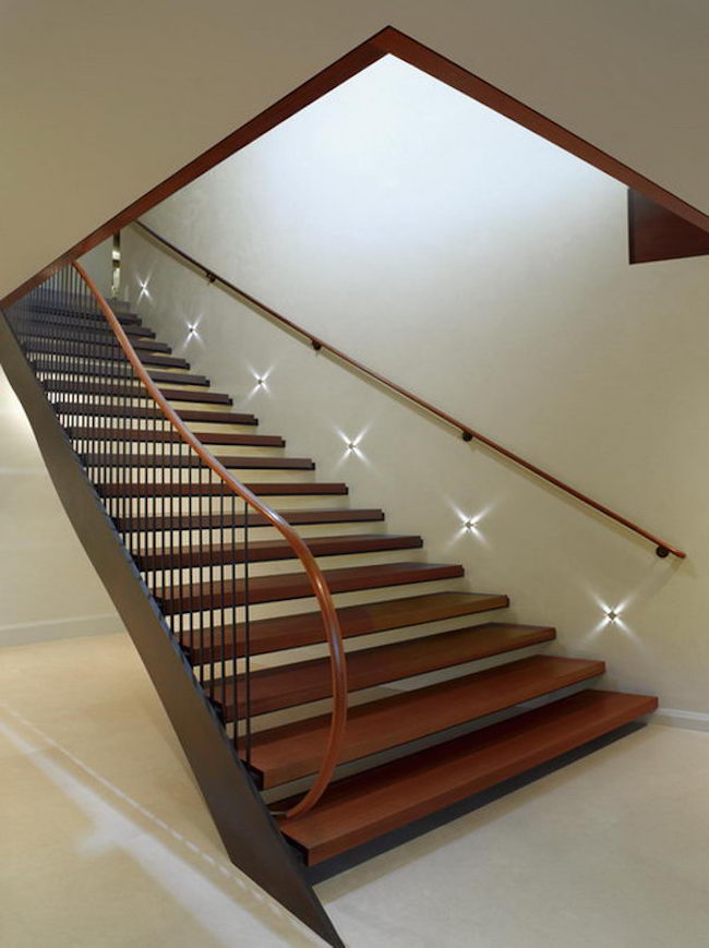 Staircase with star-like lights along the wall