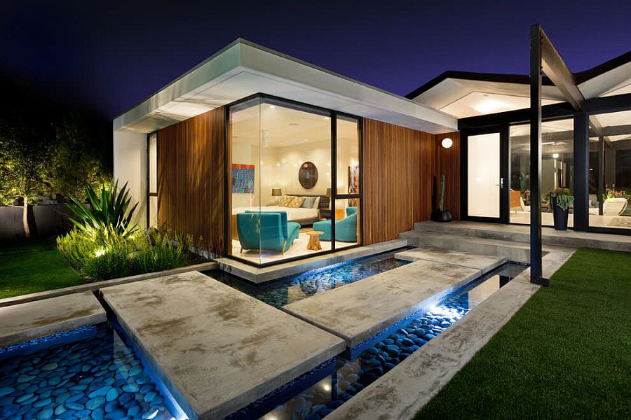 Stepping stones and reflecting pool shape the dazzling entry of the LA Home with ocean views