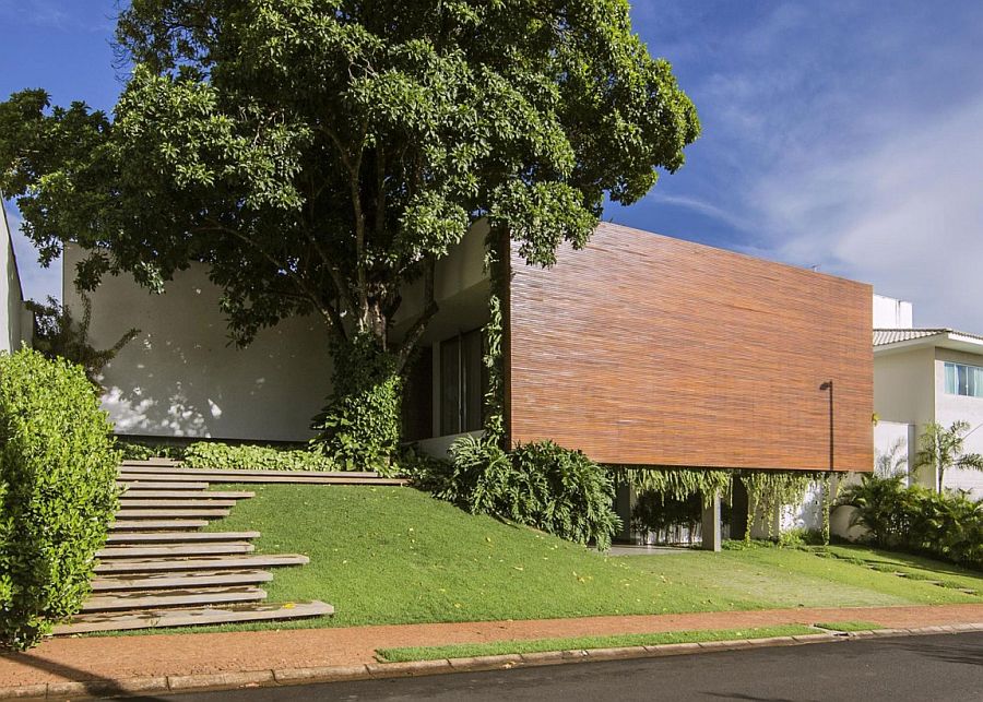 Street view of the RMJ Residence in Brazil with wooden wall