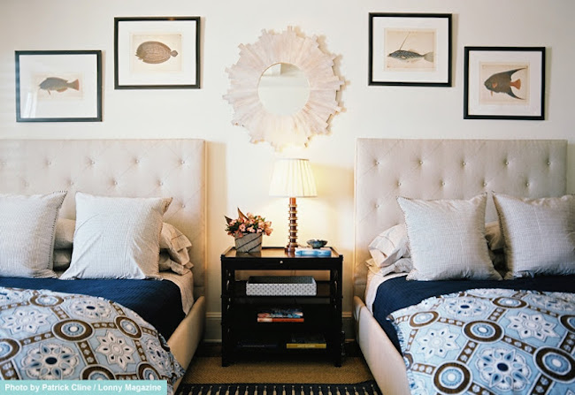 Tufted upholstered head boards on two twin beds