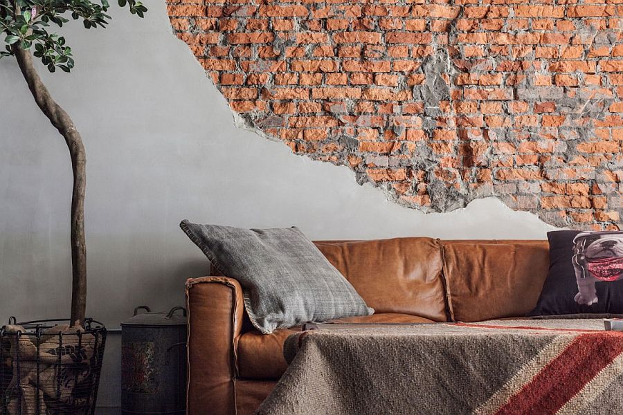 Unfinished and exposed brick wall in the living room