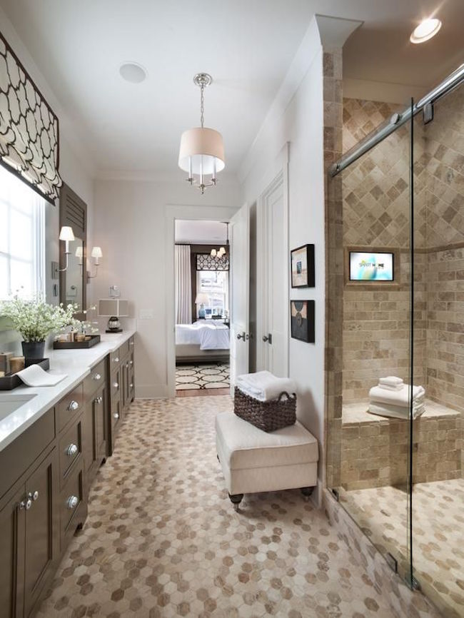 Upholstered ottoman in master bathroom