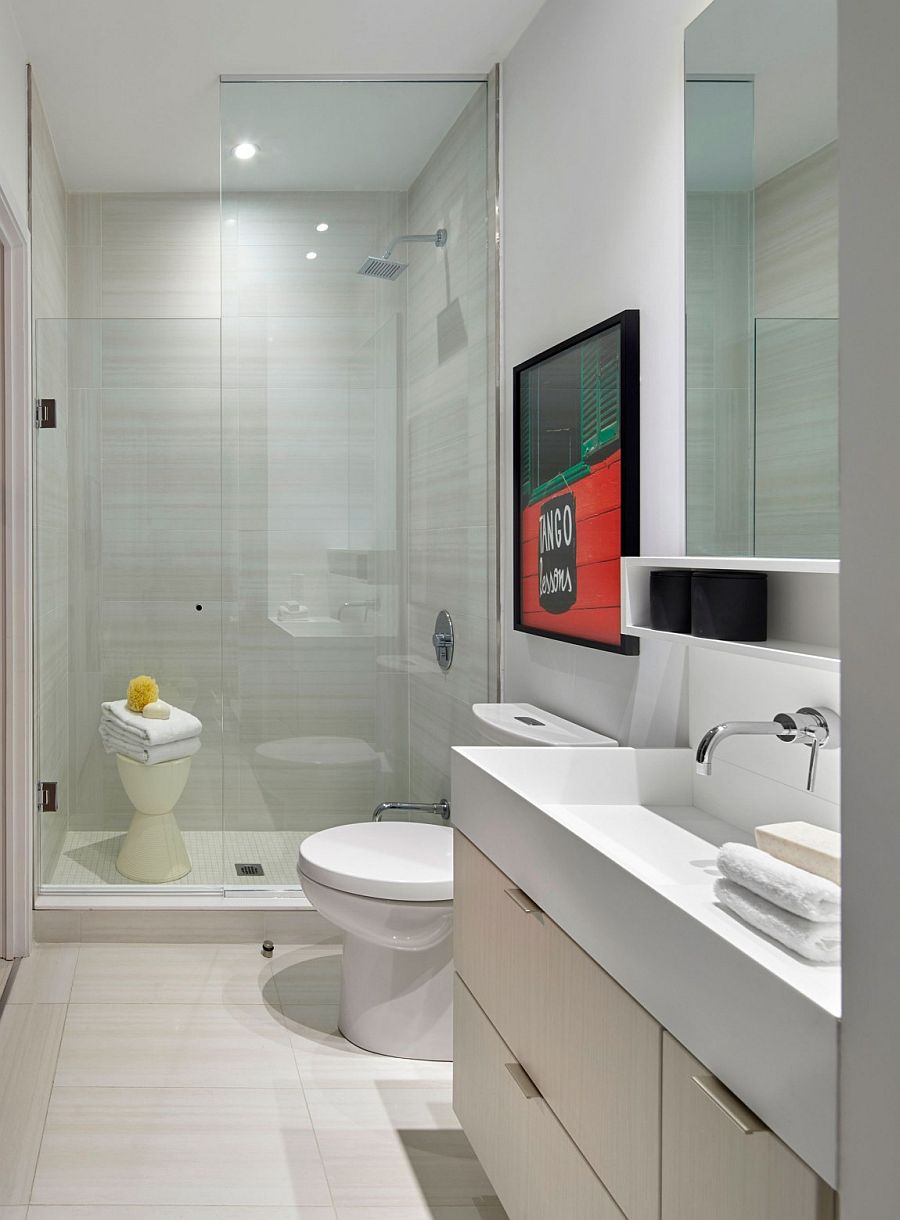 Wall art brings color to the posh, contemporary bathroom