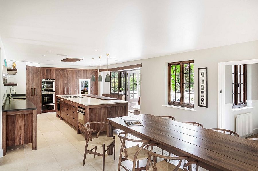 White kitchen with cabinets, island and workstation in wood