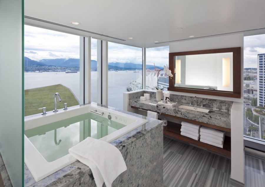 Window-filled bathroom with a sea view