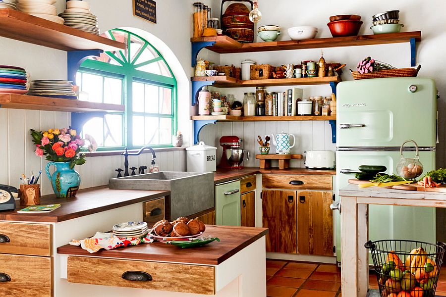 Wooden shelves and cabinet doors bring farmhouse charm to the eclectic kitchen [From: Rikki Snyder Photography]