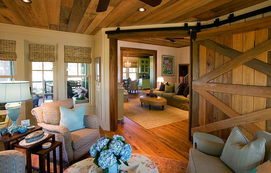 Add that country charm to the living room with a reclaimed barn door [Design: Gerald D. Cowart]