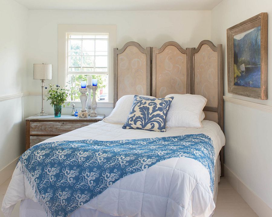 Antique French frame with hand-painted screen and vintage bedside table in the bedroom [Design: Lisa Teague Design Studios]