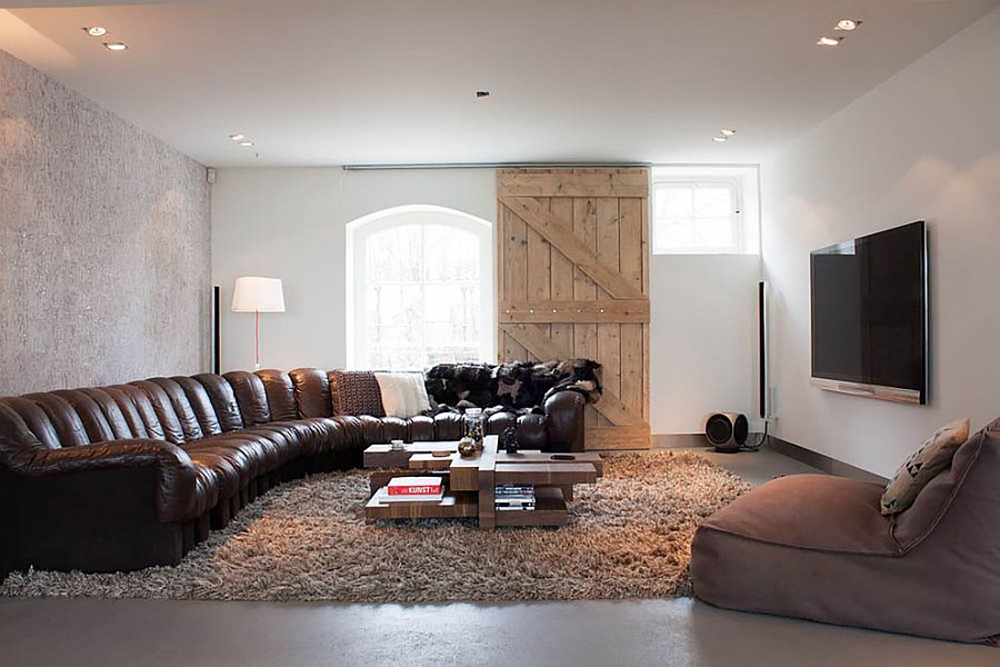 Barn door adds rustic touch to the cozy, contemporary living room