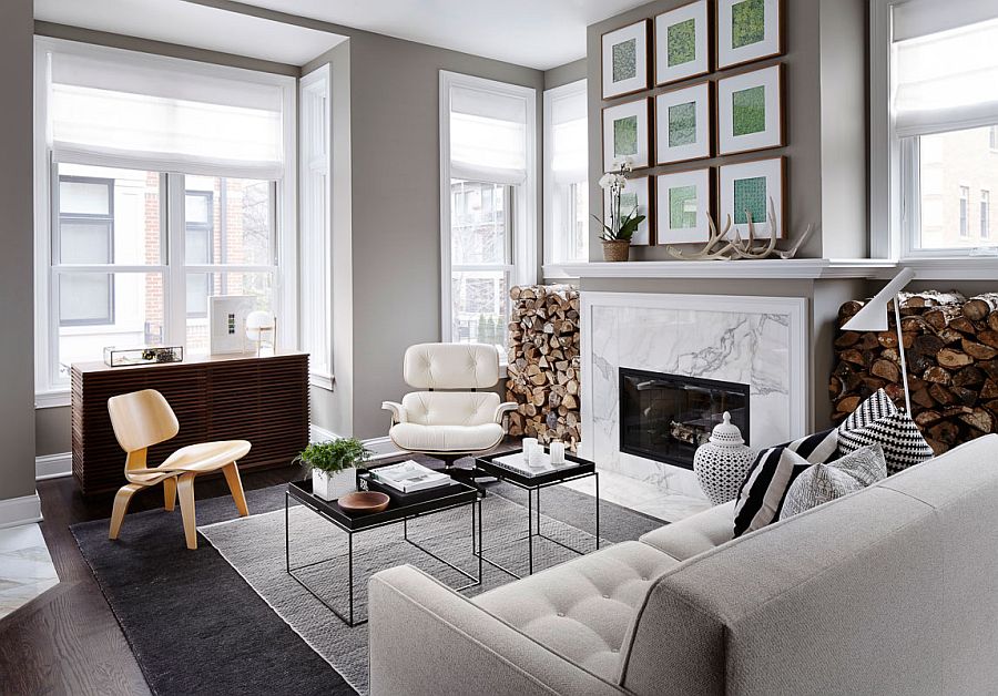 Beautiful living room fireplace with marble face and a gallery wall above