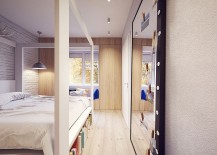 Bedroom-with-sleek-Scandinavian-style-and-a-giant-mirror-217x155