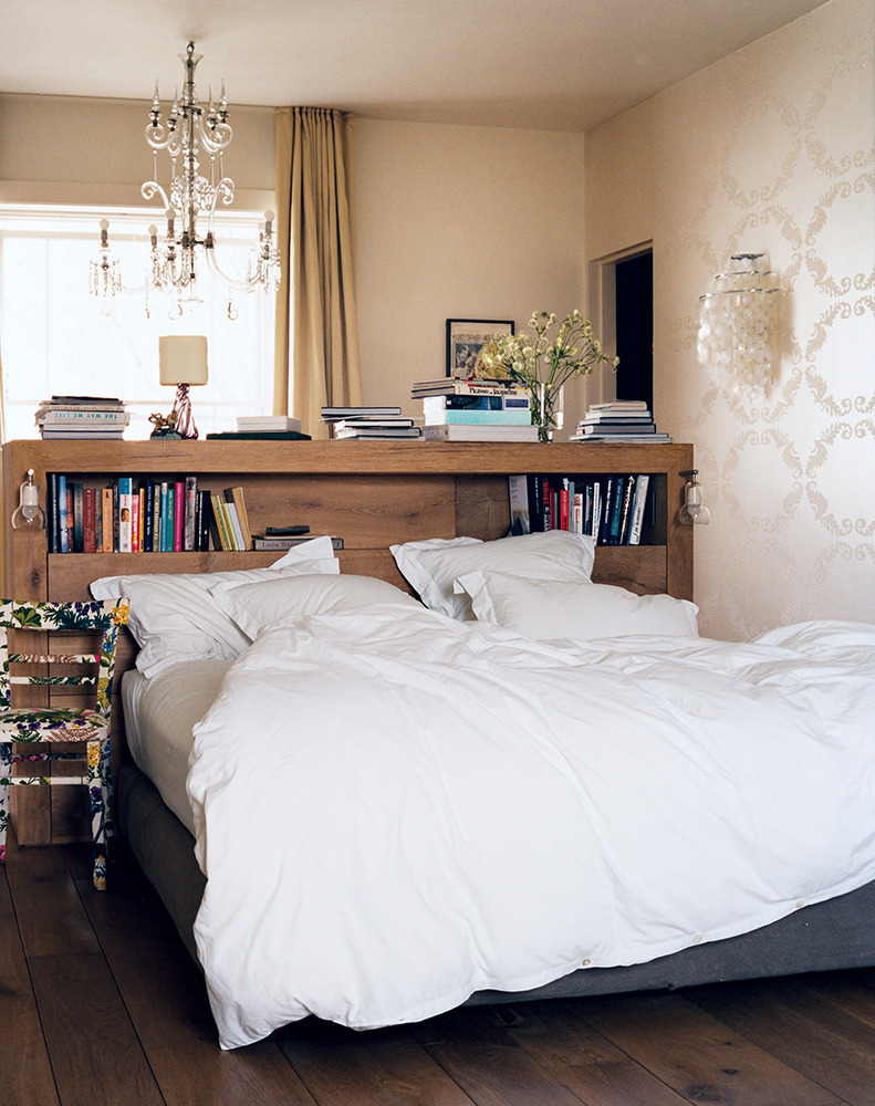 Bookshelf headboard that separates two sections of a room