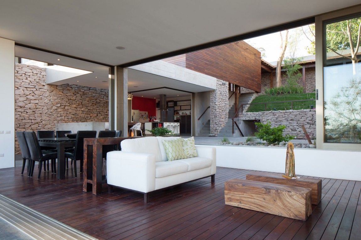 Breezy and beautiful interiors of the home are constantly connected with the central garden