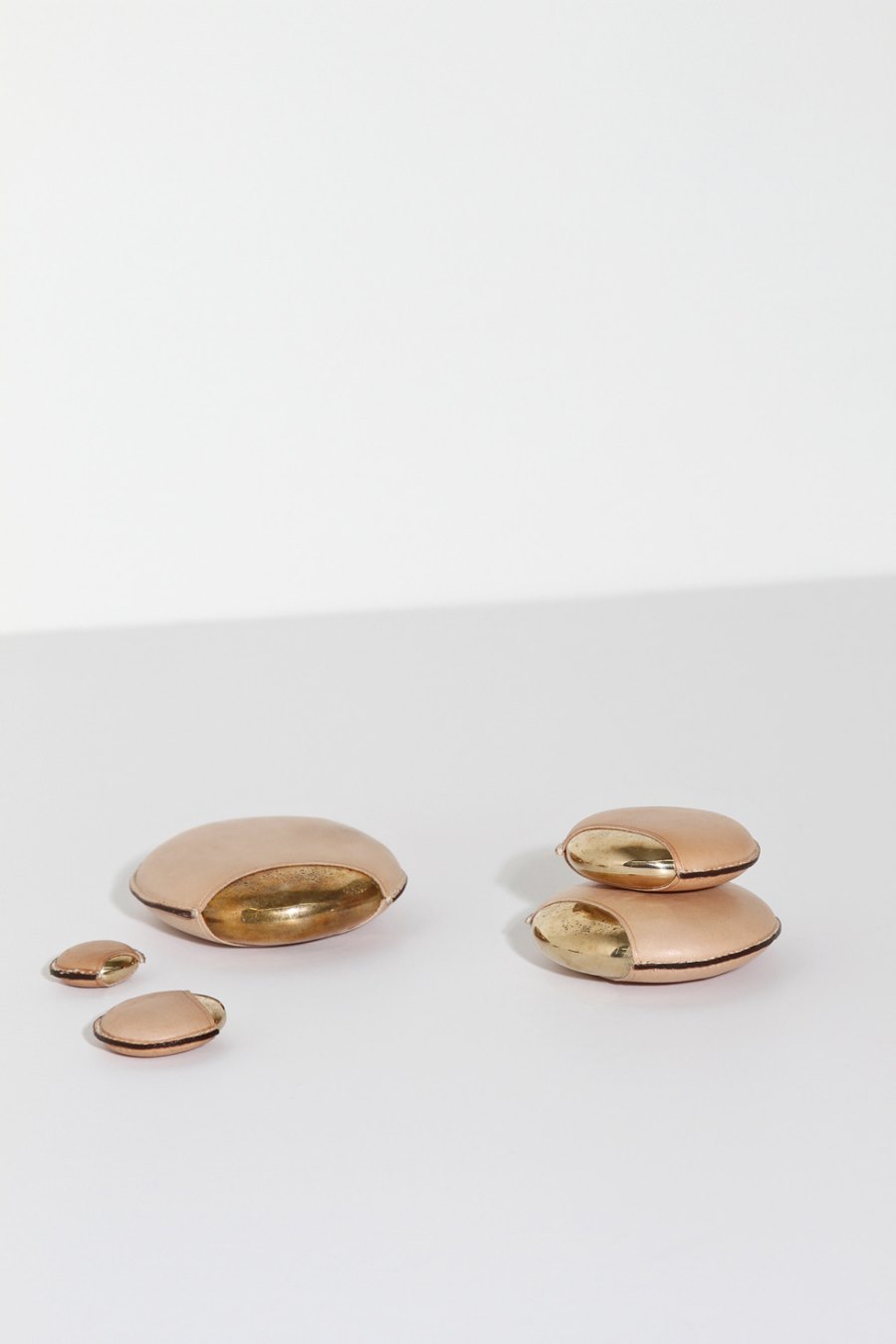 Bronze and leather objects from Table of Contents Studio