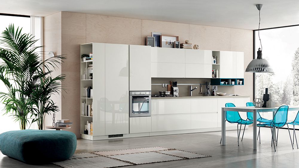 Central table in the kitchen complements the sleek style of the kitchen shelves in glossy white