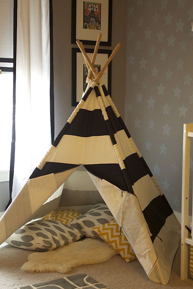 Classic teepee made with sticks and striped fabric