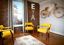 Compact-living-room-with-brick-wall-and-pops-of-yellow-and-gold-217x155