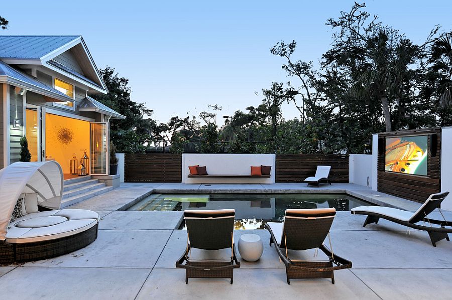 Contemporary pool area turned into outdoor movie space