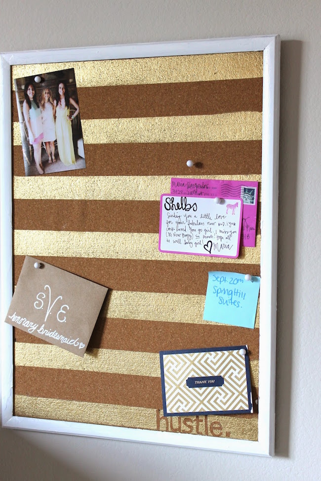 Cork board with gold painted stripes