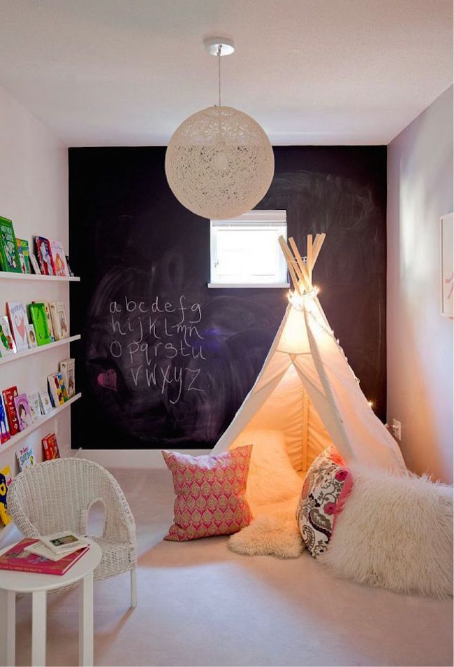 Cozy white teepee with lots of comfy pillows