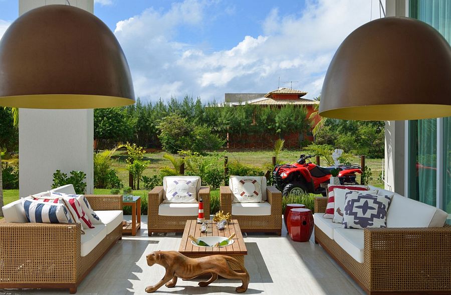 Create a fabulous outdoor lounge next to the pool with breezy outdoor furniture