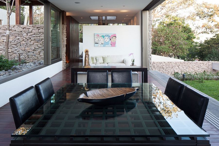 Dining table in black with glass top and black chairs