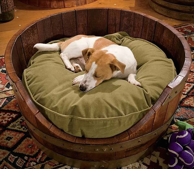 Dog bed made from an old wine barrel