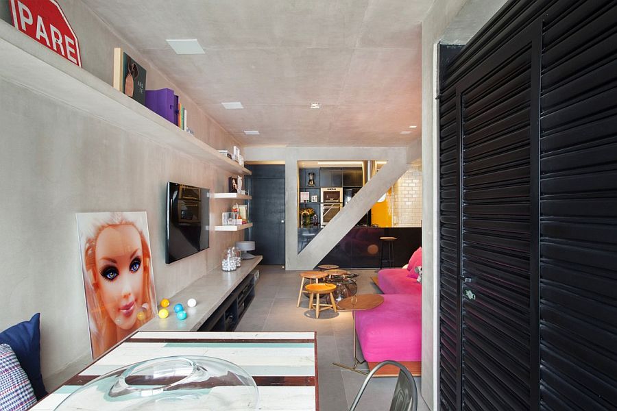 Eclectic decor and a sleek concrete bench in the living room