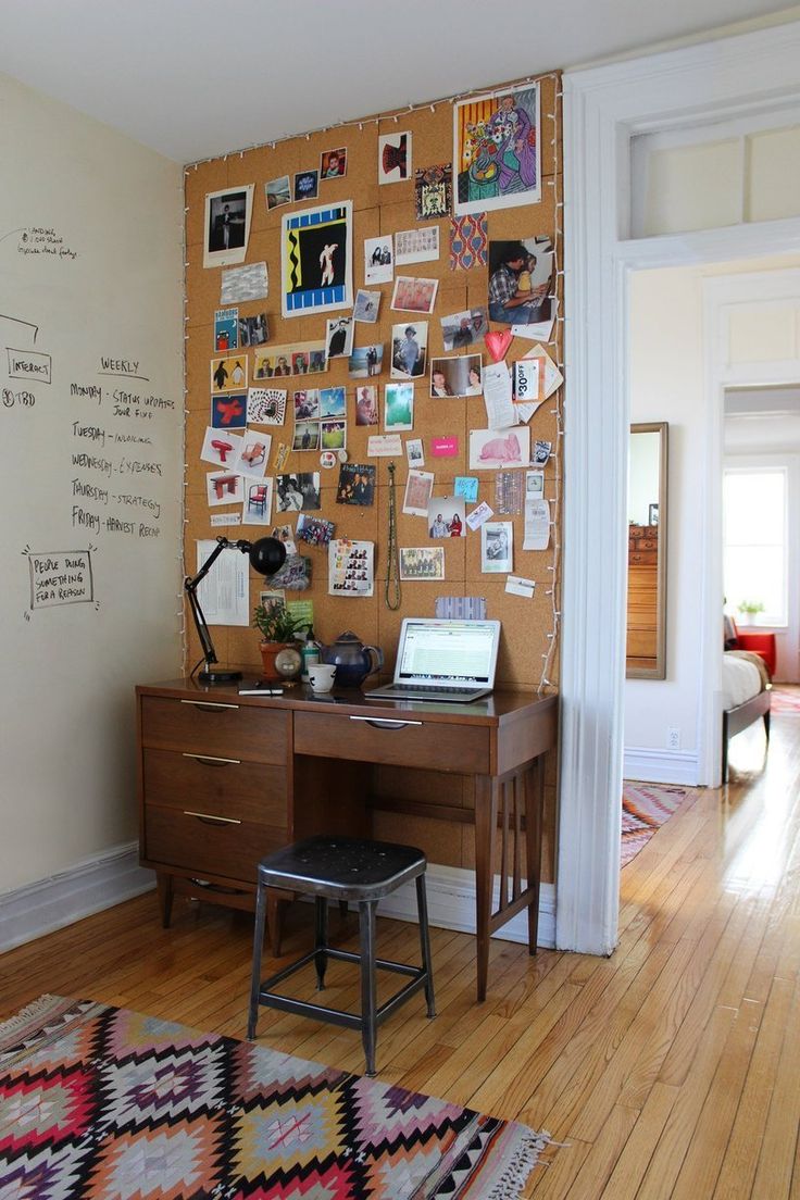 Entire wall tiled with cork board and lined with mini lights