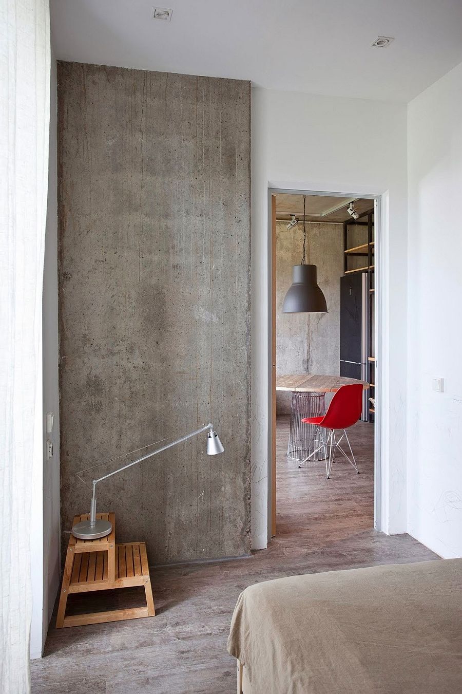 Exposed concrete wall in the bedroom