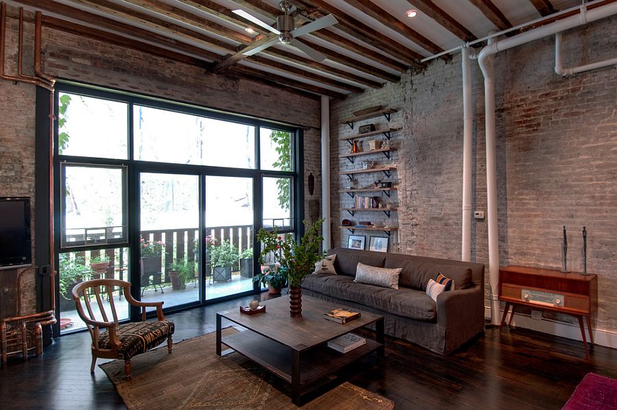 Exposed duct pipes and lovely brick walls are a staple in the industrial living room [Design: Reiko Feng Shui Design]