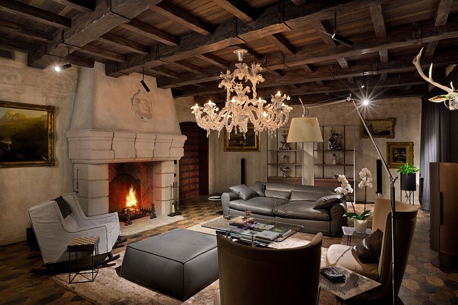 Fabulous living area with classic chandelier, lovely fireplace and walls and ceiling with a weatherd finish