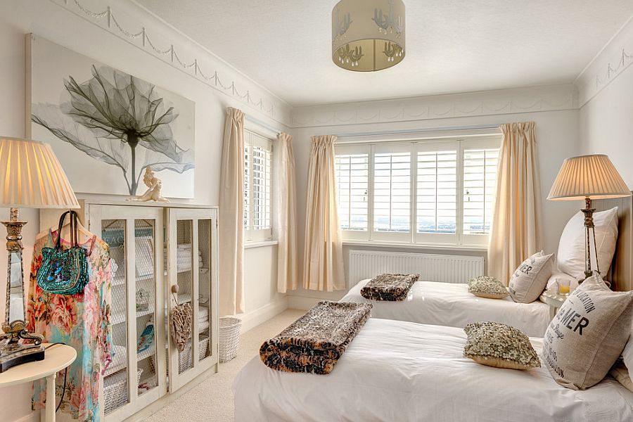 Fabulous use of pastel hues, chicken wire door cabinets and art work in the shabby chic bedroom