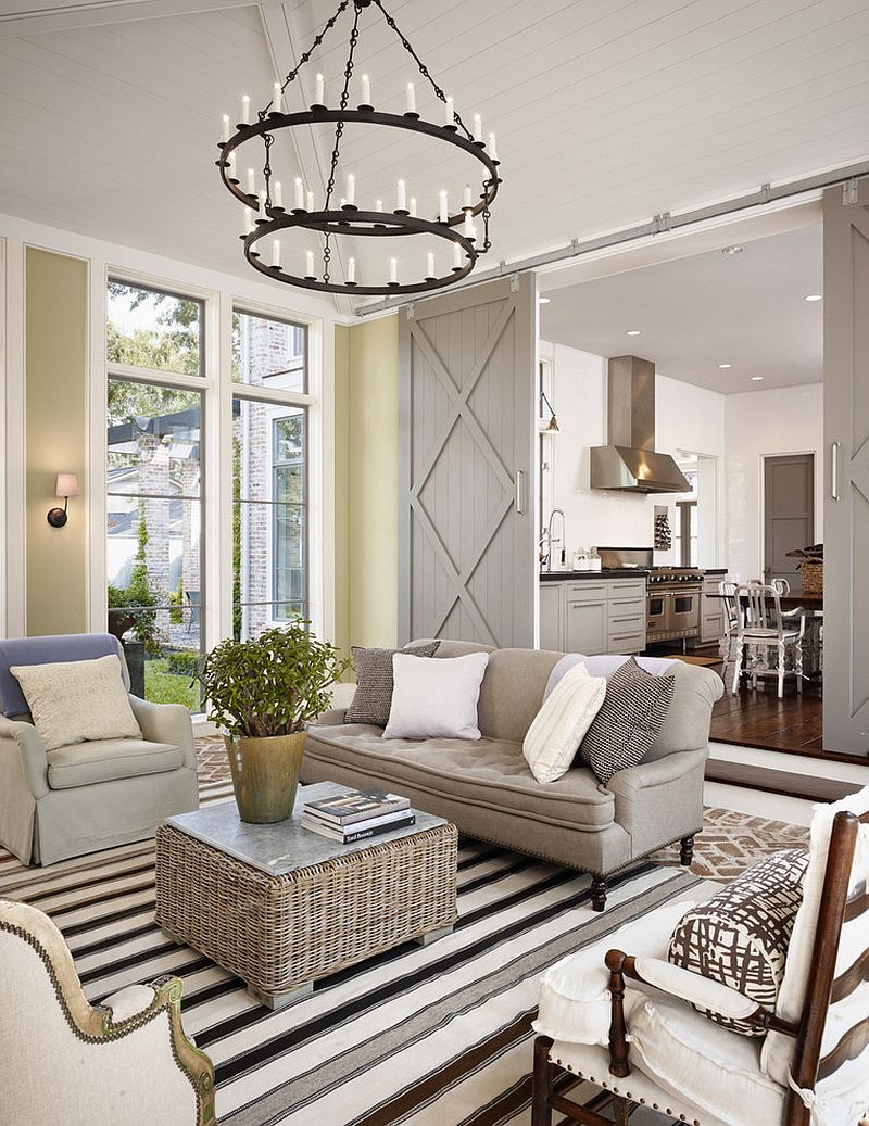 Farmhouse living room with sliding barn doors [Design: Dillon Kyle Architecture]