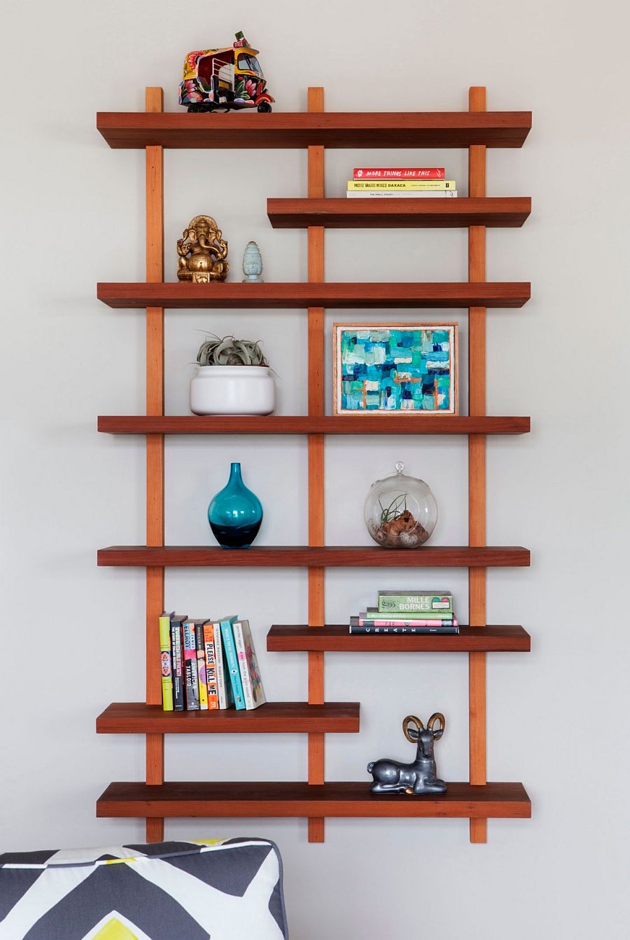 Floating wooden shelf keeps things simple and minimal