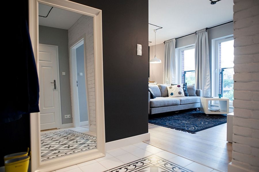 Floor tiles and rug in the living room bring pattern to the interior