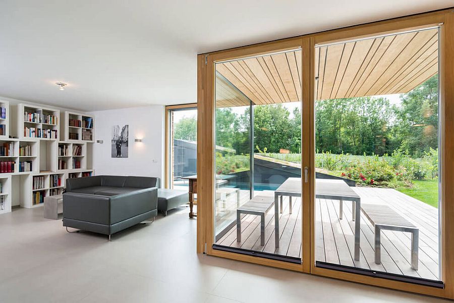 Frame glass doors lead the way from the living room to the backyard