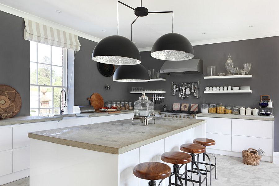 Giant chandelier above the kitchen counter steals the spotlight here [Design: VSP Interiors]