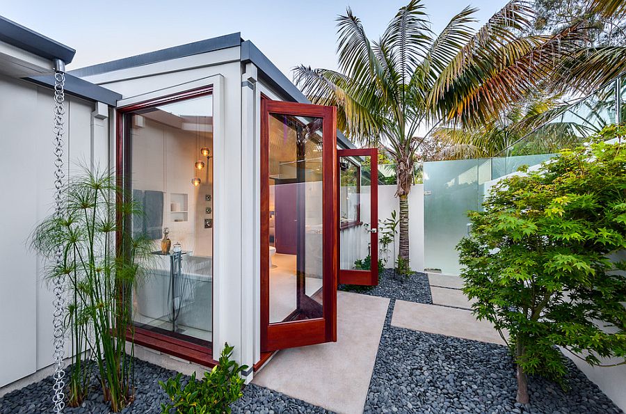 Glass doors give the bathroom an outdoorsy appeal