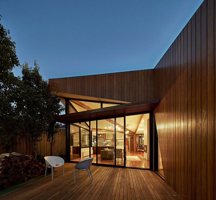 Glass walls and timber deck give the Aussie home a modern vibe