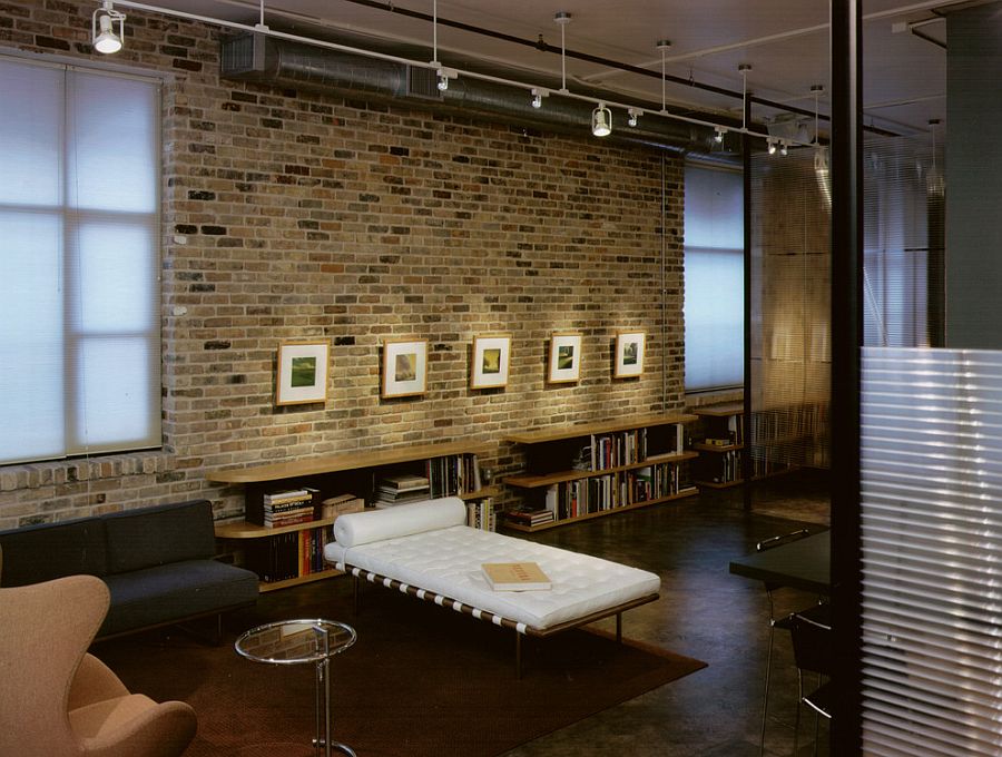 Gorgeous lighting and brick wall create an art gallery-styled display in the Downtown Austin home [Design: Tim Cuppett Architects]