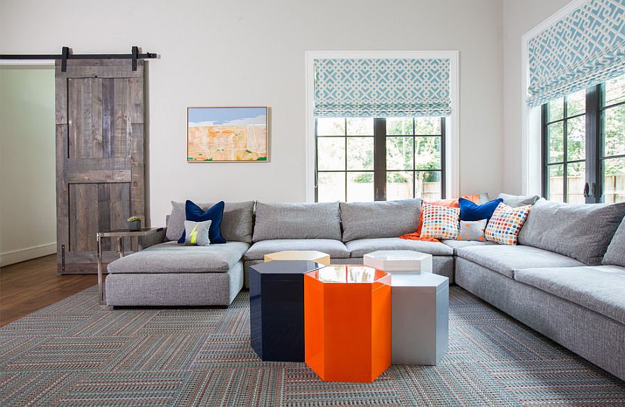 Gray of the barn door blends with the color palette of the living room