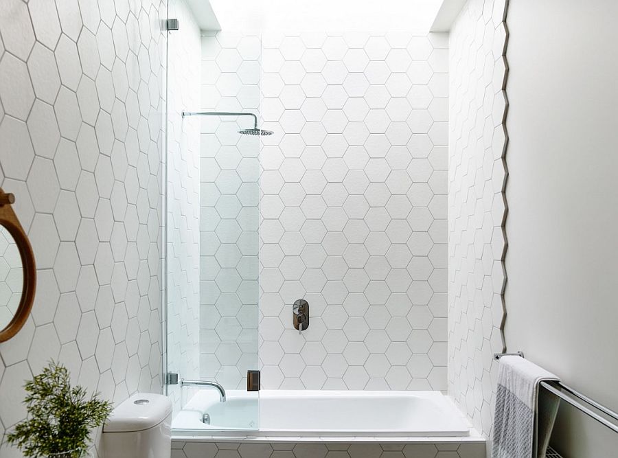 Hexagonal tiles add pattern to the bathroom in white