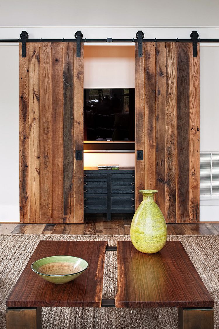 Hide the living room TV behind custom sliding barn doors